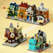 Mini street shop models including a bookshop, café and clock tower