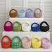 Mini puffer tote bags in 14 colours on white shelves