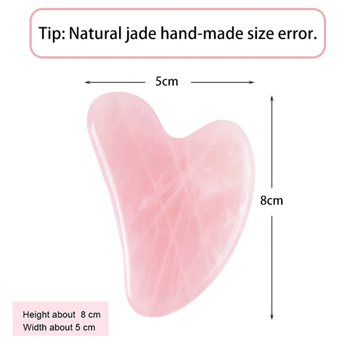 Pink heart-shaped gua sha tool, about 8 x 5 cm