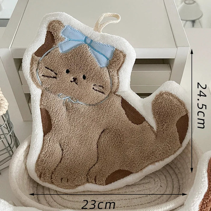 Light brown cat hand towel with a blue bow, 23 x 24.5 cm