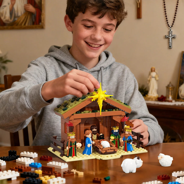 Teen building the nativity scene building block set