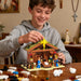 Teen building the nativity scene building block set