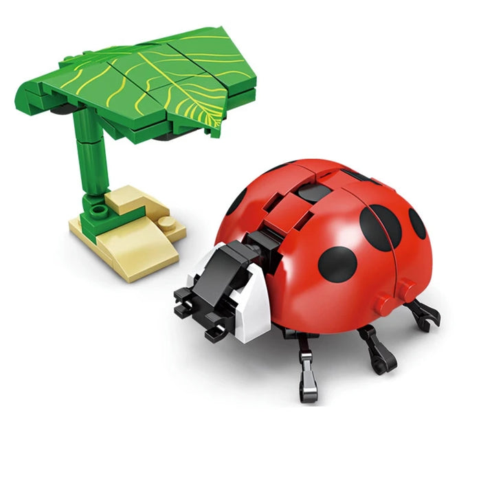 Ladybug building block model under a green leaf