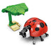 Ladybug building block model under a green leaf