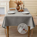 Light grey linen-look tablecloth on a dining table