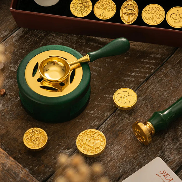 Green wax melting stove with spoon and gold wax seals