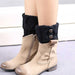 Black knit boot cuffs over beige ankle boots
