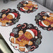Black gingerbread Christmas placemats on a white table