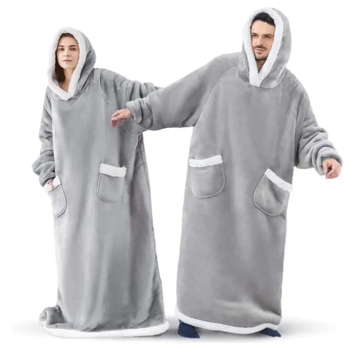 Two people in grey long blanket hoodies