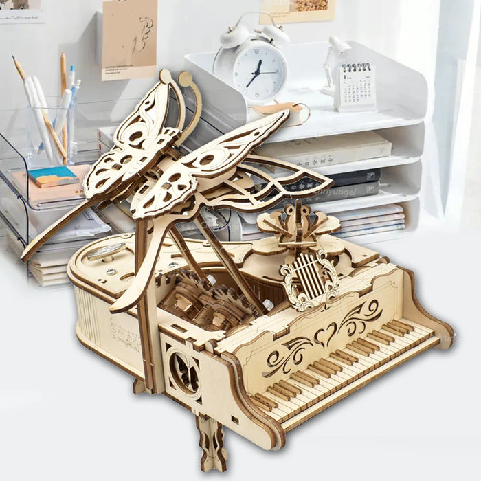 Wooden piano music box on a white shelf