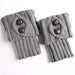 Pair of light grey knit leg warmers with two buttons
