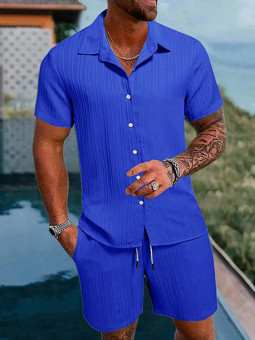 Man in a sapphire blue short sleeve shirt and shorts set