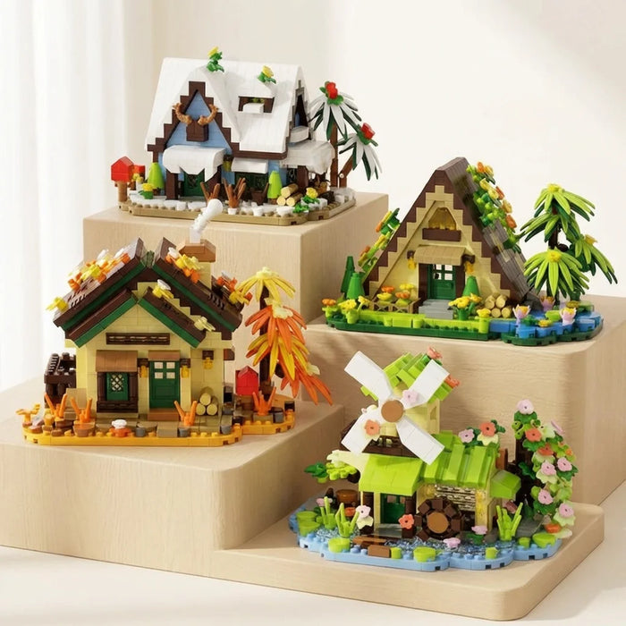 Four mini cabin building block sets on a display stand