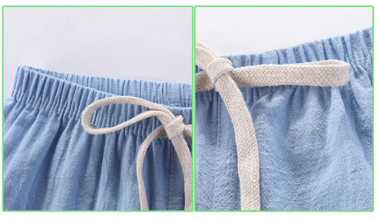 Close-up of the elastic waist and drawstring on light blue shorts