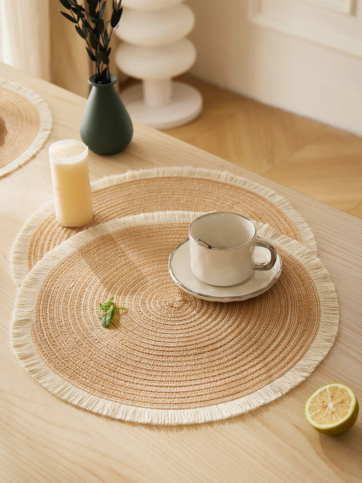 Woven placemat with a coffee cup on a wooden table