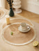 Woven placemat with a coffee cup on a wooden table