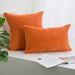 Orange corduroy cushions, square and rectangular