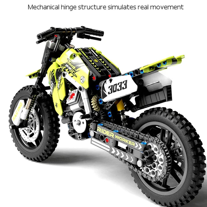 Rear view of the green dirt bike model showing the hinged drive
