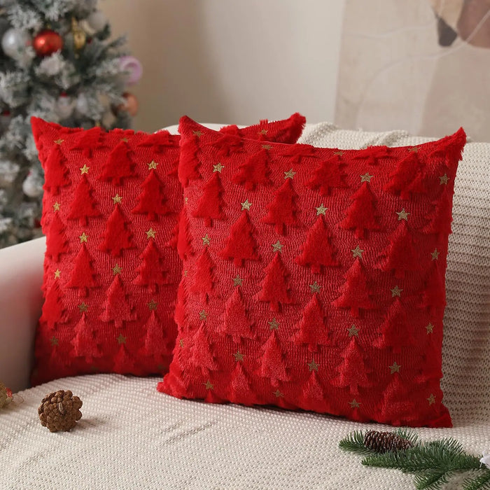 Two red tree cushion covers with gold stars