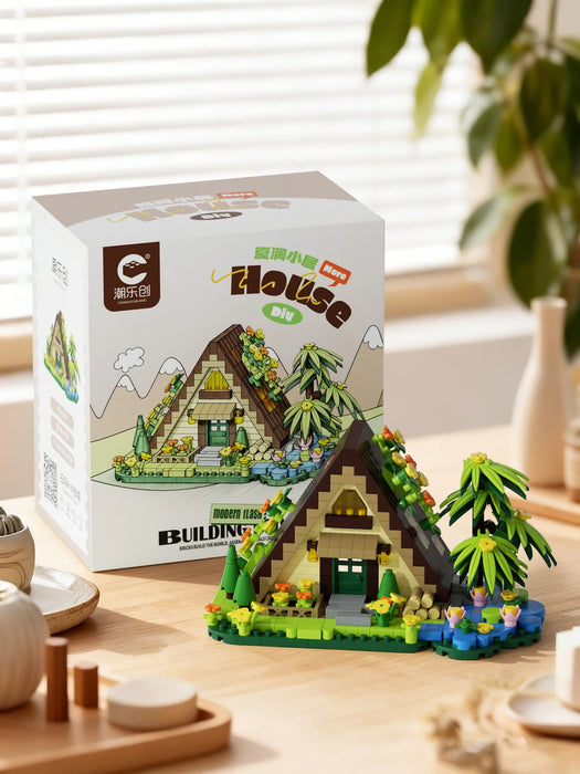 A-frame forest cabin set in front of its box