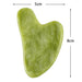 Green heart-shaped gua sha tool, about 8 x 5 cm