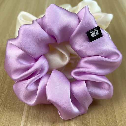 Lilac silk scrunchie on a wooden table