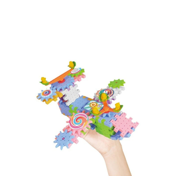 Hand holding a plane built from gear blocks