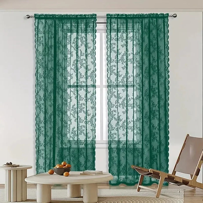 Green floral lace curtain panels in a living room