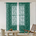 Green floral lace curtain panels in a living room