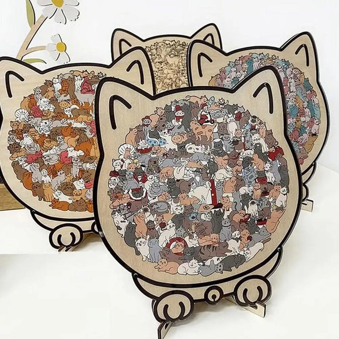 Three finished cat-shaped wooden puzzles standing together