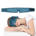 Woman napping on a pillow in a blue sleep mask
