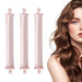 Three pink satin curling rods beside a woman with wavy hair