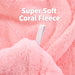 Close-up of soft pink coral fleece and the button loop