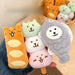 Hand holding bread bear, dango puppy and fish cake puppy charms