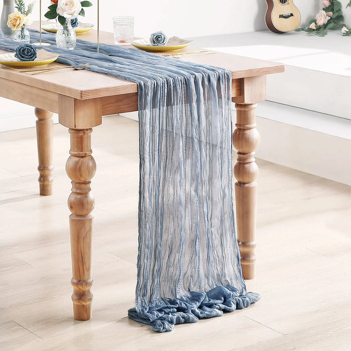 Grey blue gauze table runner on a white table