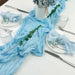 Sky blue gauze runner with blue napkins