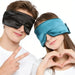 Man and woman wearing black and blue sleep masks