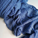 Close-up of a blue cheesecloth table runner