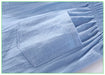 Close-up of the back patch pocket on light blue shorts