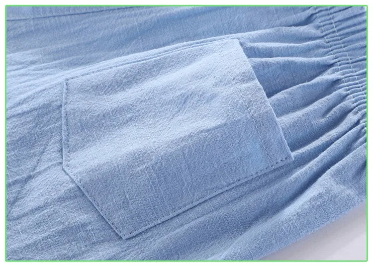 Close-up of the back patch pocket on light blue shorts
