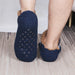 Sole of a slipper sock with silicone grip dots
