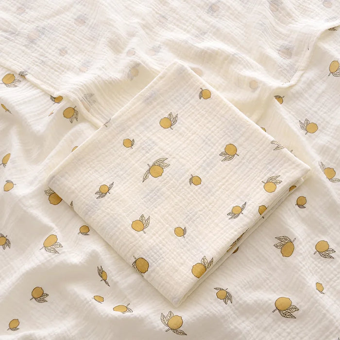 Muslin swaddle blanket with lemon print