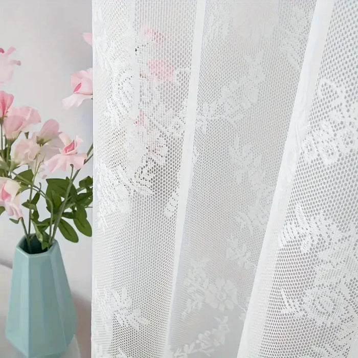 Close-up of white floral lace and the scalloped edge