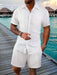 Man in a white textured short sleeve shirt and shorts set