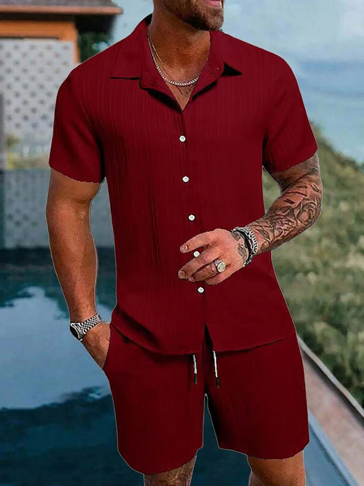 Man in a dark red short sleeve shirt and shorts set