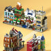 Row of mini street shop models with cafés, a bakery and a hotel