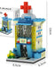 Blue hospital building block model with red cross, 13 cm tall