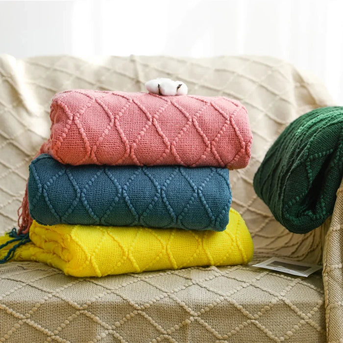 Folded diamond knit throws in pink, teal, yellow and green