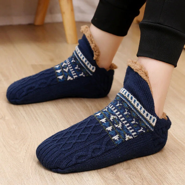 Person wearing navy knit slipper socks