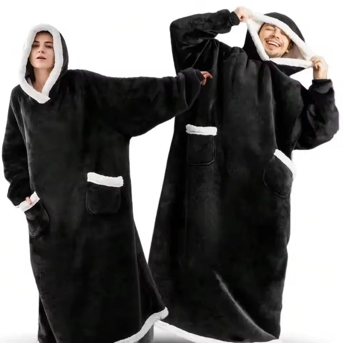 Two people in black long blanket hoodies